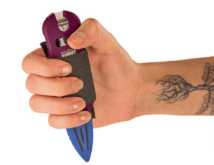 GO-GUARDED-HAND-HELD-WITH-STUN-DEVICE-Go-Guarded hand holding stun gun with attached knife pointing at the buttom