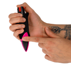 Self-Defense-Knife-w-Pepper-Spray-Go-Guarded hand holding self defense pepper spray with finger pointing at knife