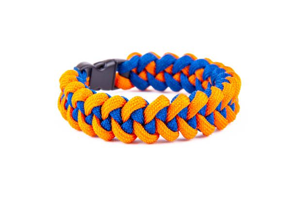 Paracord bracelet isolated on white background Orange Paracord Bracelet