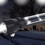 flashlight shining in the dark and snow