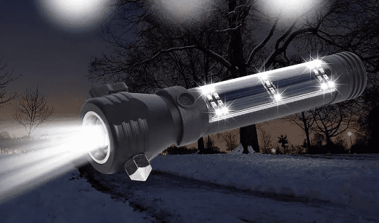 flashlight shining in the dark and snow